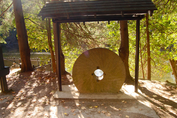an old mill wheel displayed at Belfountain Conservation Area