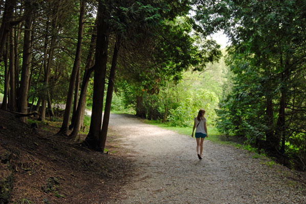 walking along a path through the woods towards the quarry near Elora, Ontario