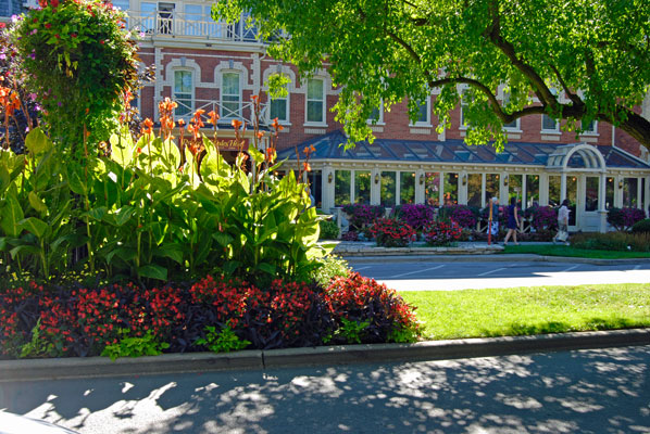 lush flower beds in the foreground of a view of the Prince of Wales Hotel in Niagara-on-the-Lake