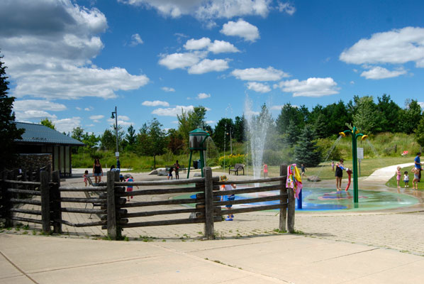 children enjoy water features in the Richmond Green splash pad