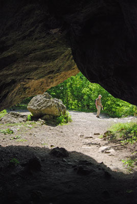 looking out from inside a cave