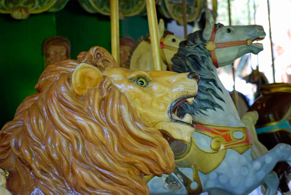 close-up of a lion’s head on the antique carousel