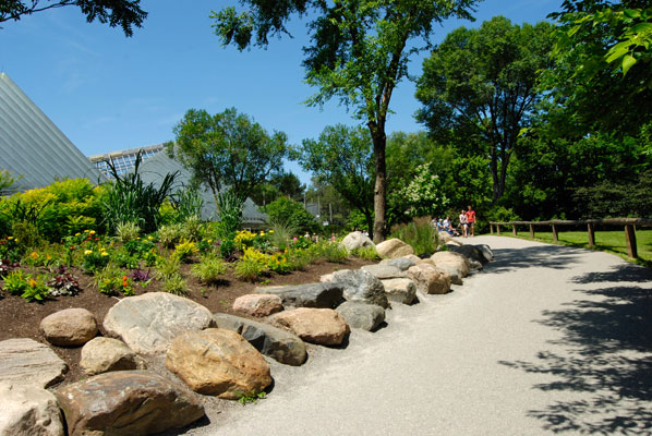 a stone path bordered by large stones near the African pavilion at the Toronto Zoo